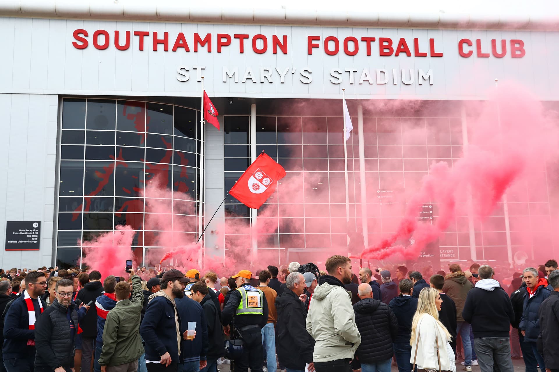 A general view of Southampton fans holding smoke flares outside the stadium