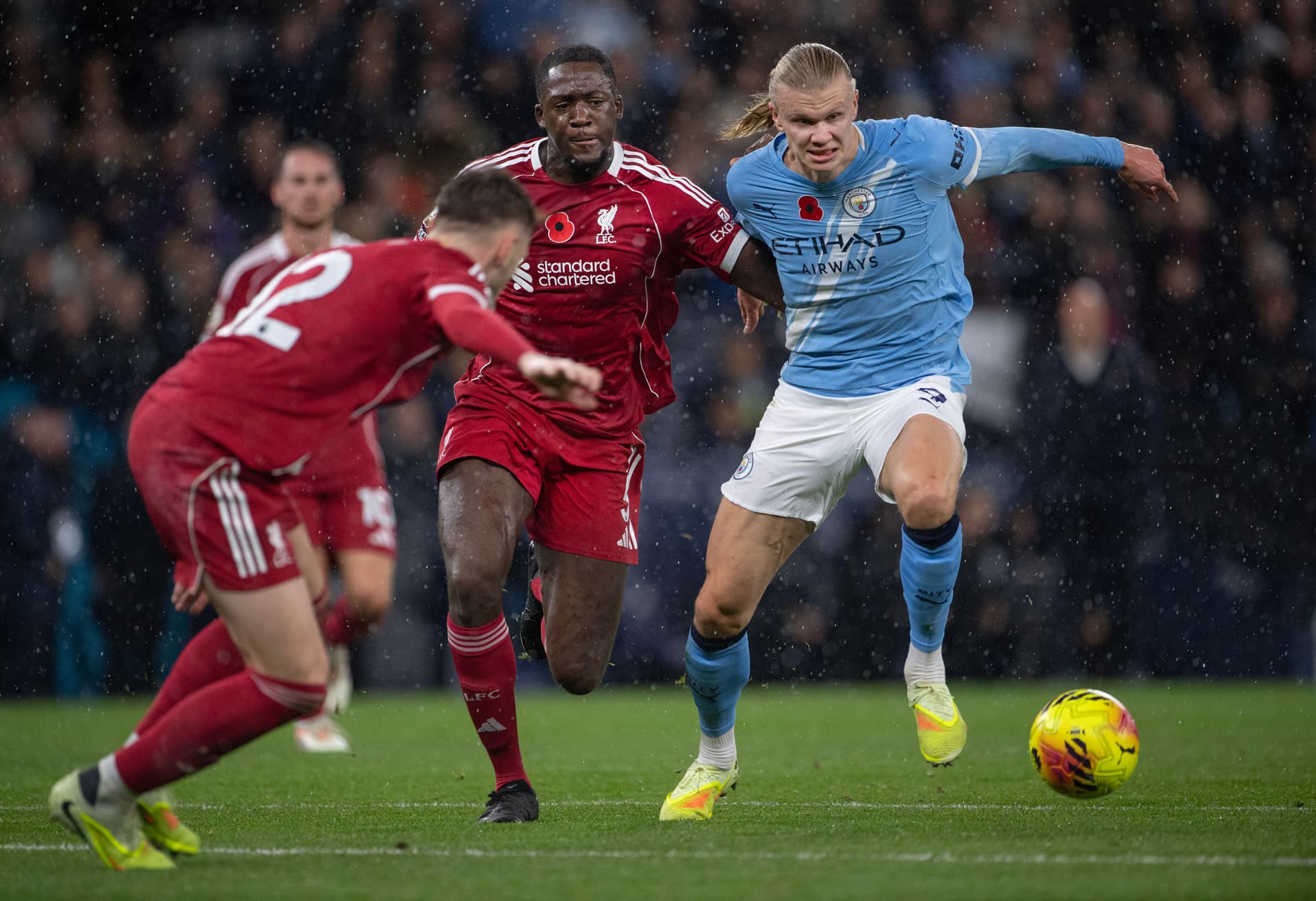 Erling Haaland of Manchester City in action with Ibrahima Konate and Conor Bradley