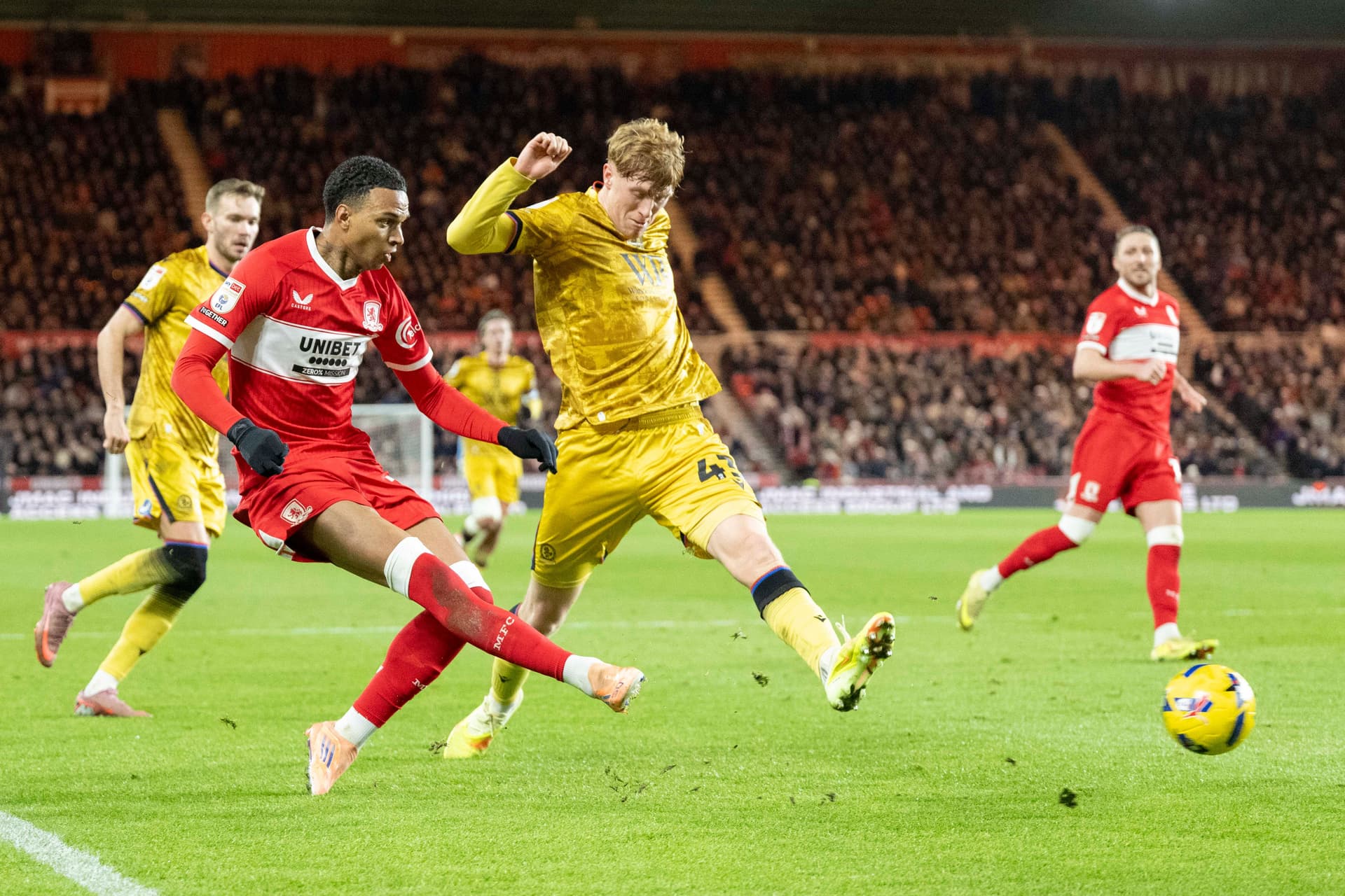 Morgan Whittaker of Middlesbrough crosses the ball under pressure from George Pratt